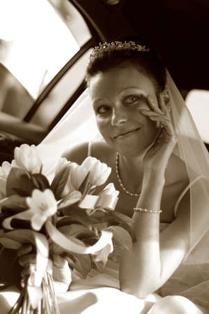 Beautiful the bride in car. b/w+sepiaの写真素材