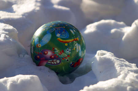 Children's ball on snowの写真素材