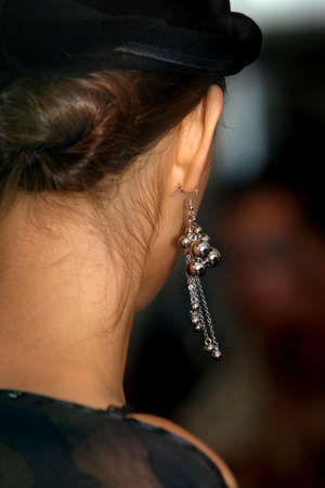 The image of an ear with an ear ring close-upの写真素材