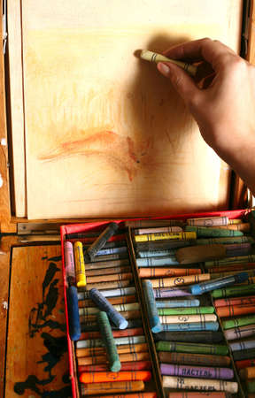 The image of a female hand with a pencilの写真素材