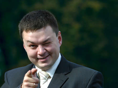 Cheerful the man with a hand extended forwardの写真素材