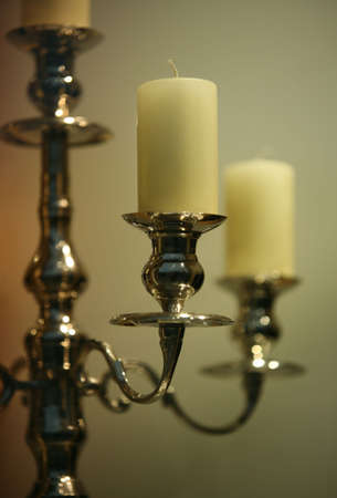 The not lit candles in ancient gold candelabrumの写真素材