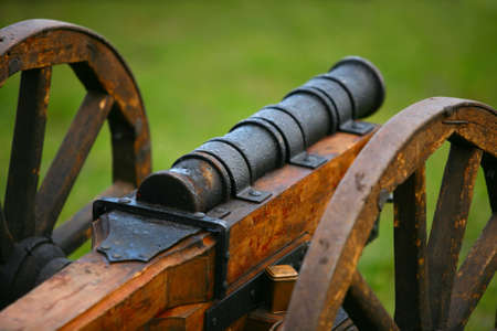 The horizontal image of a medieval gun on a green backgroundの写真素材