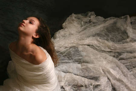 The little girl wrapped up in a fabricの写真素材