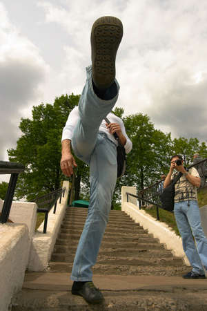 The man makes the big step coming downstairsの写真素材