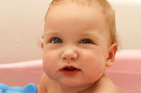 The little child taking a bath close-up