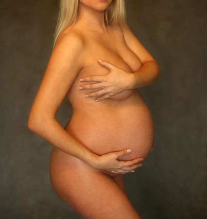 The pregnant woman on the ninth month. The child will be born one of these daysの写真素材