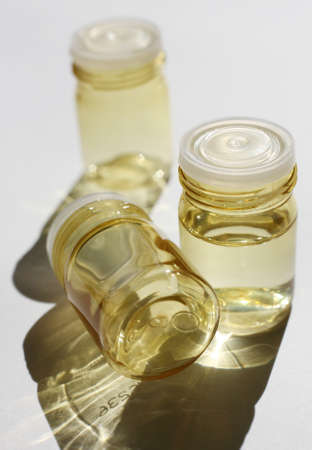 Three clear containers in the sunの写真素材