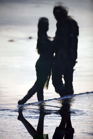 Couple on sunset. Coast of the Indian oceanの写真素材