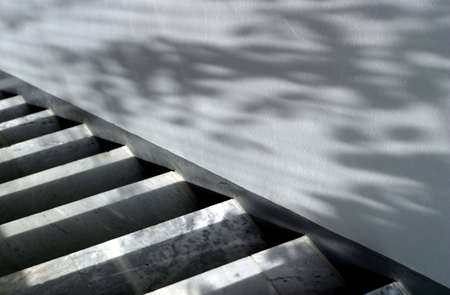 Marble ladder and wall with shadowsの写真素材