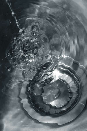 Rainwater running along galvanized steelの写真素材