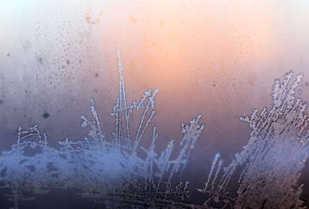 Frosty natural pattern on winter windowの写真素材