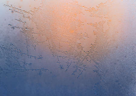 Frosty natural pattern on winter windowの写真素材