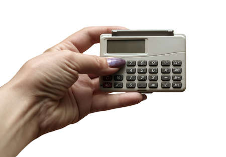 The female hand holds the calculator on a white backgroundの写真素材