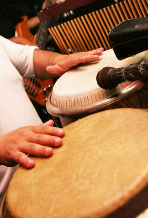 Man playing the djembe (nigerian drum)