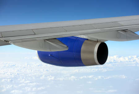 Wing of the plane on a background of sky