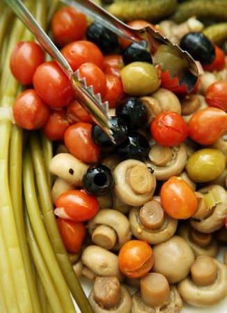 The olives, pickled tomatoes and mushroomsの写真素材