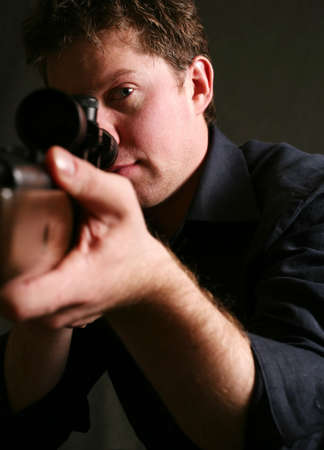 The man with the weapon in studio の写真素材