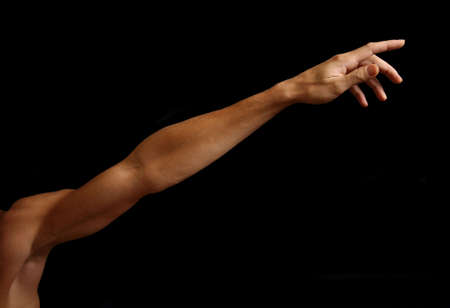 Man's hand on a black background の写真素材