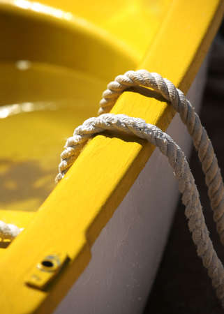 Yellow boat with a rope close-upの写真素材