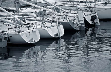 Tall luxury boats and yachts moored in duquesa Port In Spain