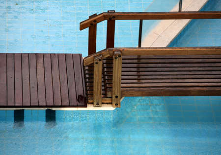 Swimming pool and the wooden bridgeの写真素材