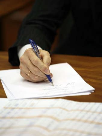 Hand of the businessman with pen