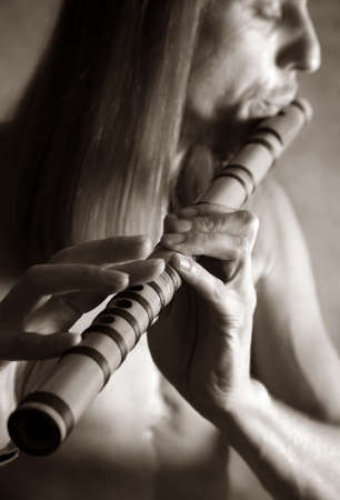 A man playing his wind instrument with expressionの写真素材