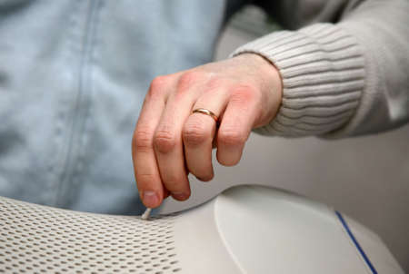 The man cleans a surface of the monitorの写真素材