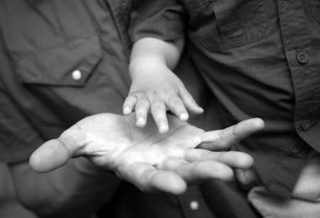 The image of hands of parents and the kid.の写真素材