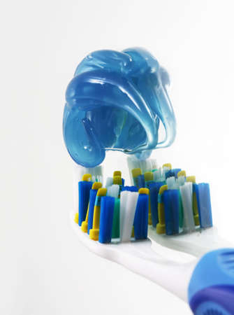 Tooth-brush with tooth-paste close-up isolated in whiteの写真素材