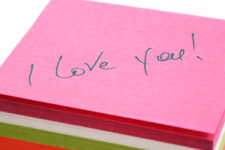 Words about love written on a pink paper