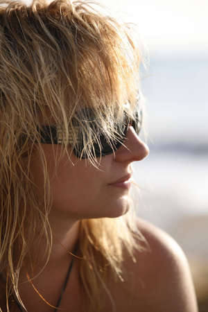 The girl with wet hair in solar glassesの写真素材