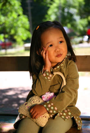 The beautiful Korean girl covered by the sun