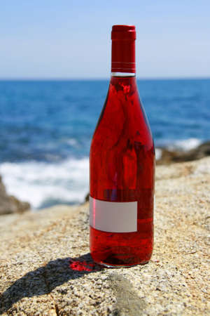 Pink wine on a background of the seaの写真素材