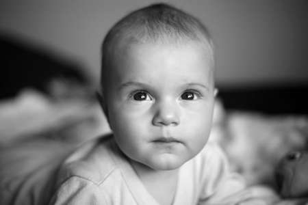 four-monthly new born child in a bedの写真素材