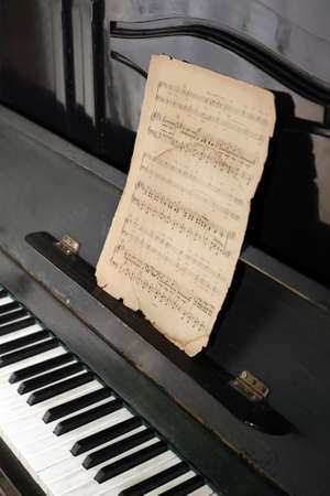 The keyboard of the piano and old notesの写真素材