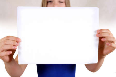 The girl with a clean sheet of a paperの写真素材