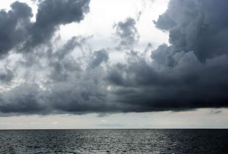 Heavy clouds above ocean before a thunder-stormの写真素材