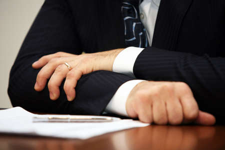 Hand of the businessman with pen