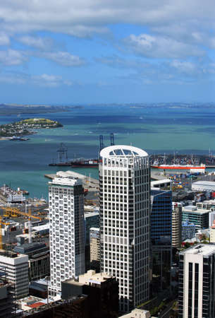  High buildings in Auckland on a background of harbour 