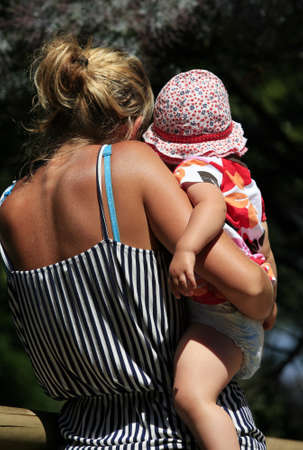 Little girl with mom in the nature