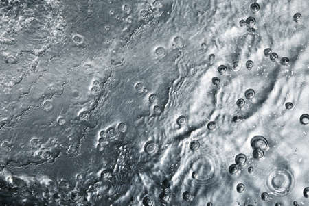 An abstract background in the form sheet metal with dropsの写真素材