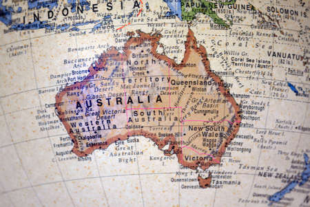 Partial view of a world globe with the spotlight on australiaの写真素材