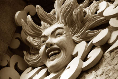 Bas-relief of the sun on a wall. Bali. Indonesia