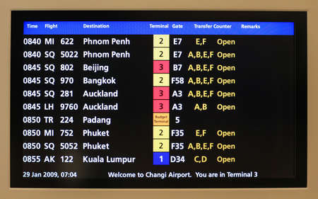 Flight announcement shows time of departure on a screenのeditorial素材