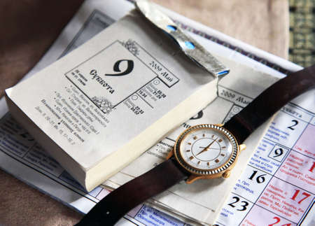 Appointment desk calendar and old hoursの写真素材