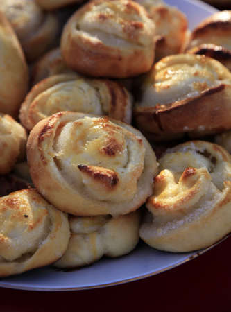 Sweet cinnamon rolls on a plateの写真素材
