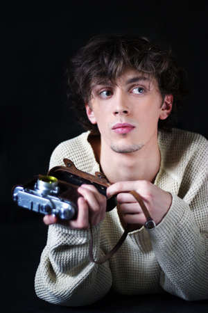 The young man with the cameraの写真素材