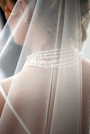 The bride in a veil expecting the groomの写真素材